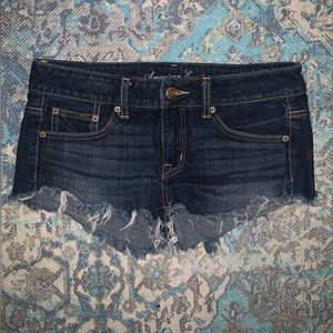 Dark wash distressed American Eagle shorts